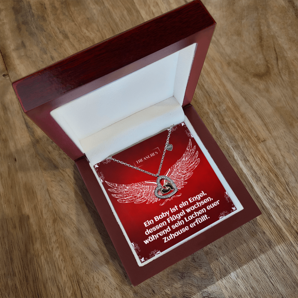 Herzförmige Halskette mit funkelnden Zirkonia und zarten roségoldenen Babyfüßchen – ein Symbol für Liebe, Familie und Neuanfänge.