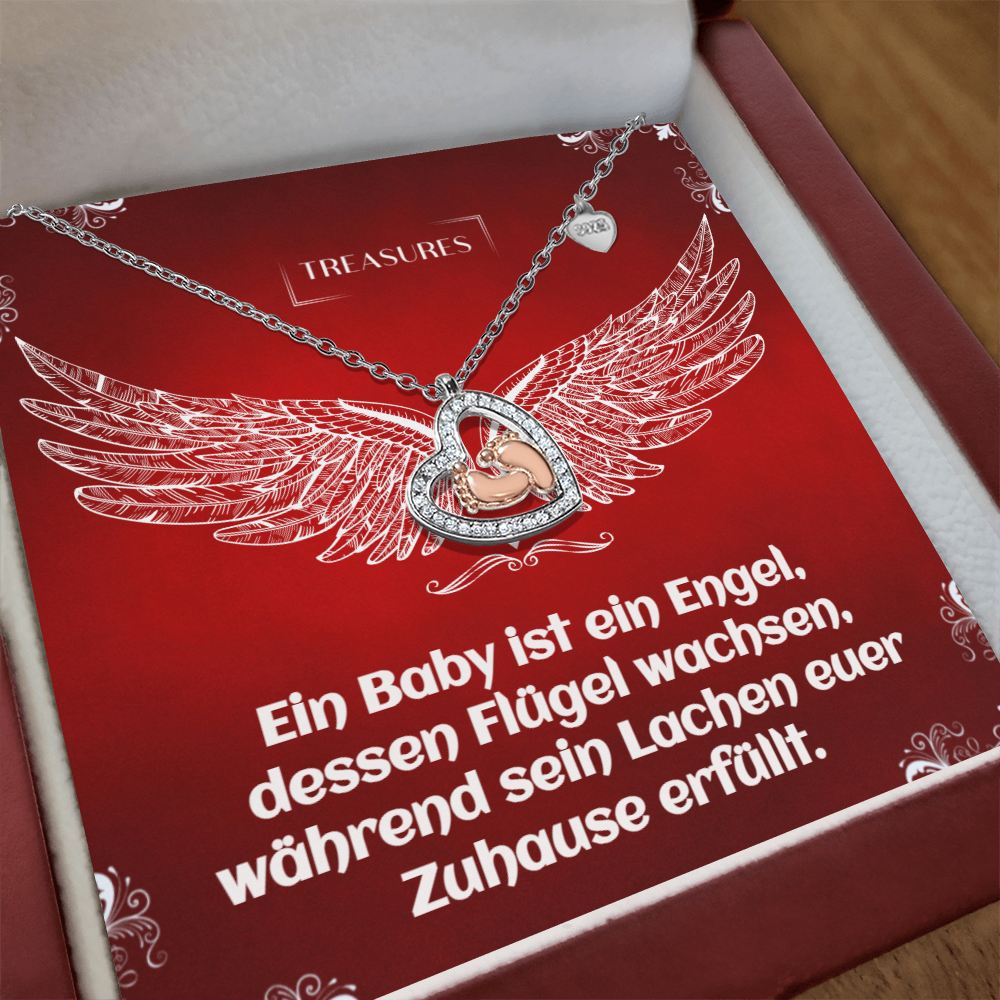 Herzförmige Halskette mit funkelnden Zirkonia und zarten roségoldenen Babyfüßchen – ein Symbol für Liebe, Familie und Neuanfänge.