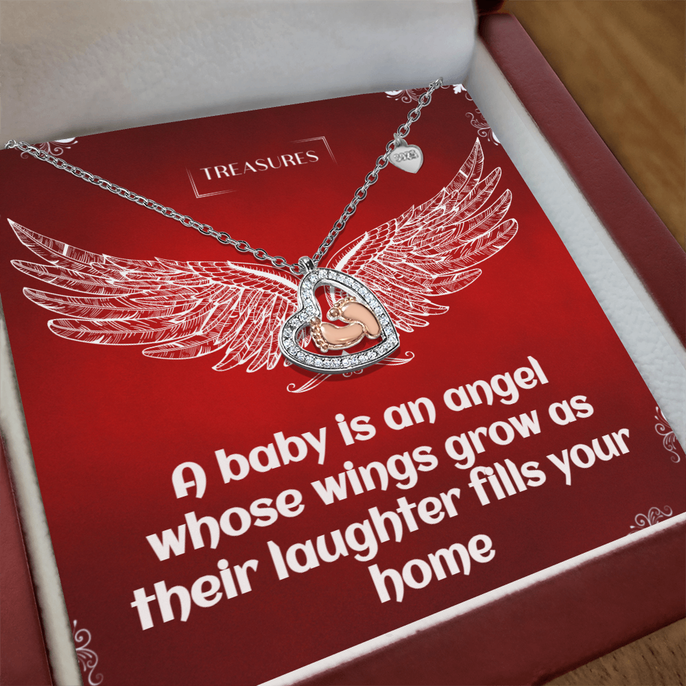 Heart-shaped necklace with sparkling cubic zirconia and delicate rose gold baby feet, symbolizing love, family, and new beginnings.
