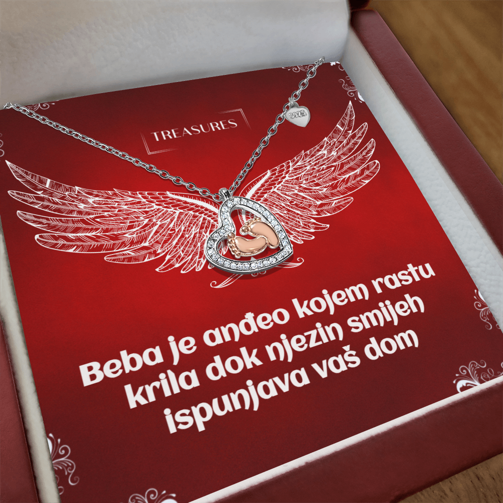 Ogrlica u obliku srca s blistavim kubičnim cirkonima i nježnim bebinim stopalima u ružičastom zlatu – simbol ljubavi, obitelji i novih početaka.
