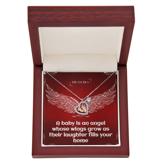 Heart-shaped necklace with sparkling cubic zirconia and delicate rose gold baby feet, symbolizing love, family, and new beginnings.
