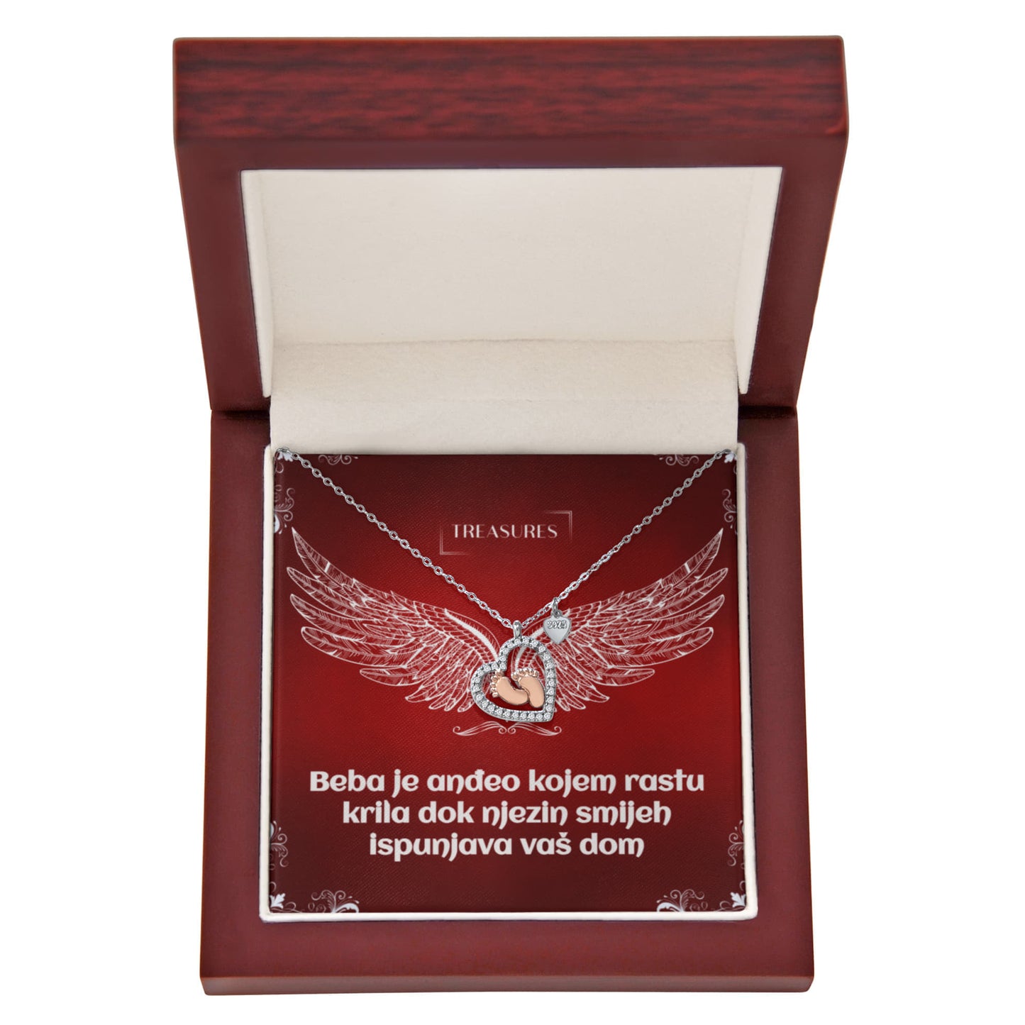 Ogrlica u obliku srca s blistavim kubičnim cirkonima i nježnim bebinim stopalima u ružičastom zlatu – simbol ljubavi, obitelji i novih početaka.
