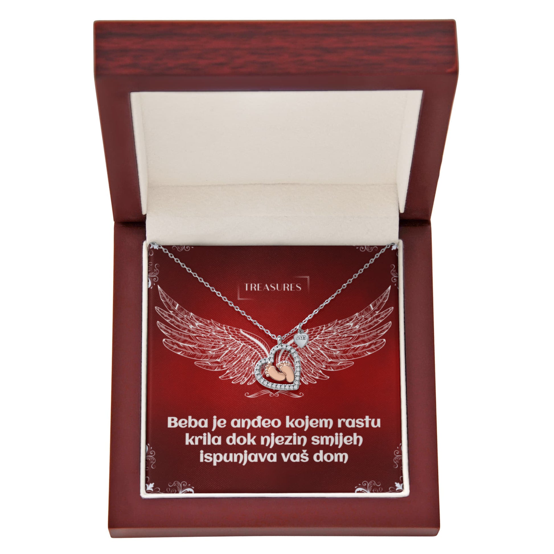 Ogrlica u obliku srca s blistavim kubičnim cirkonima i nježnim bebinim stopalima u ružičastom zlatu – simbol ljubavi, obitelji i novih početaka.
